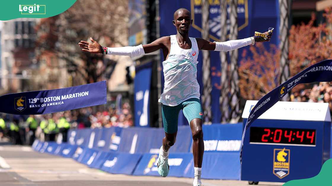 Kenyan distance runner John Korir crosses the finish line as he wins the men's race Kenyan distance runner John Korir crosses the finish line as he wins the men's race