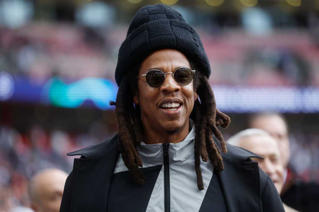 Rapper Jay Z looks on at Wembley Stadium before a UEFA Champions League match