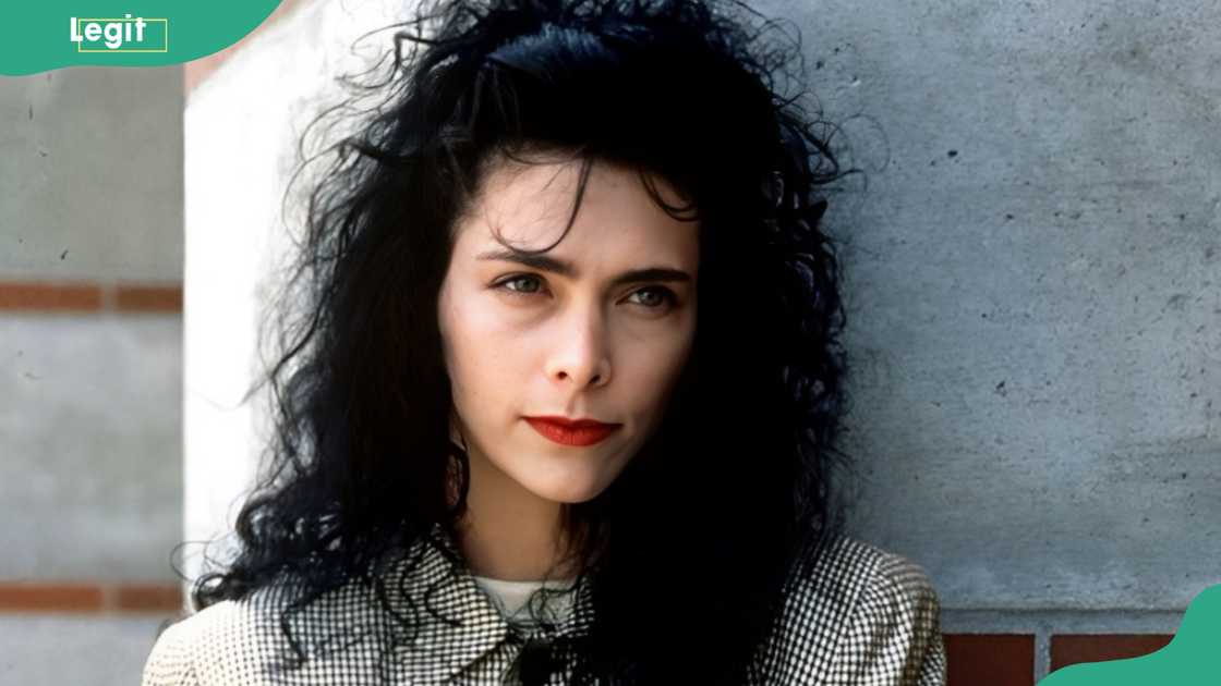 Lori Anne Allison leans on a wall as she poses for a picture Lori Anne Allison leans on a wall as she poses for a picture