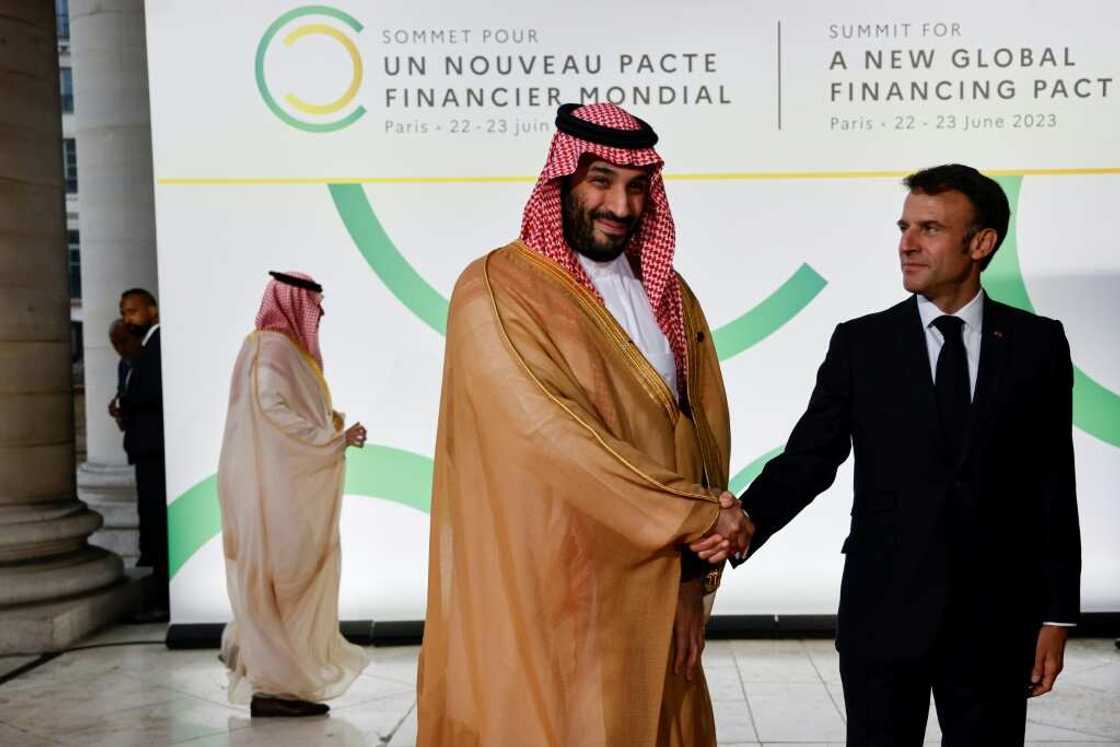 French President Emmanuel Macron (R) has assured Saudi of support from Paris