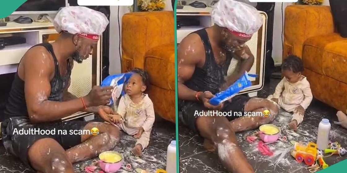 Man plays with his child.