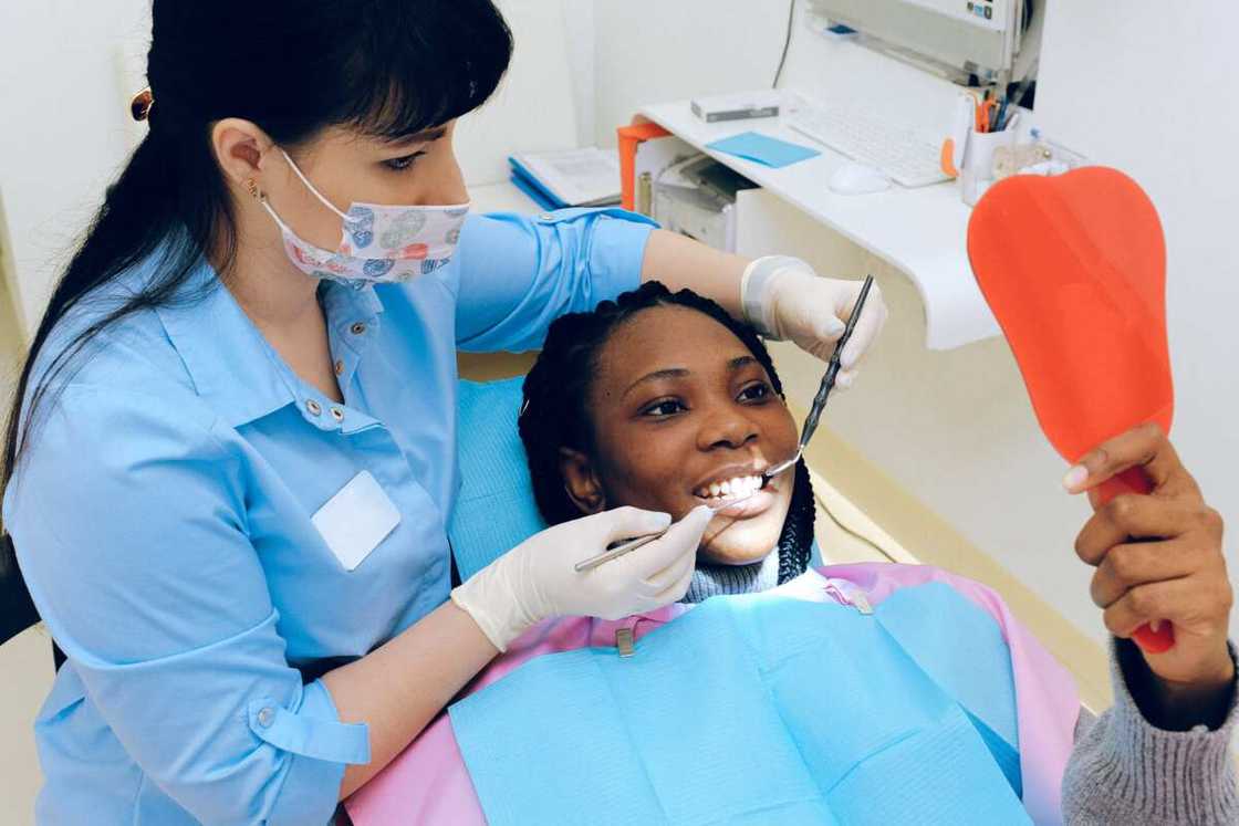 A woman having a dental check up A woman having a dental check up