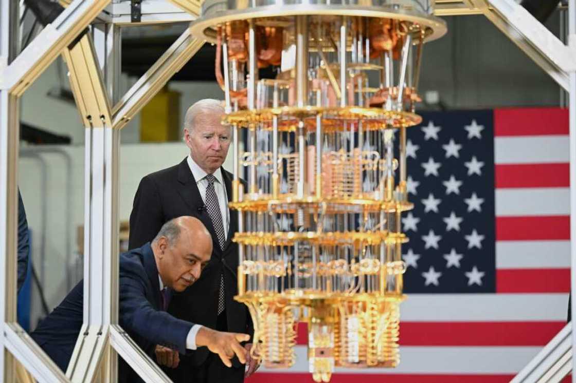 US President Joe Biden listens to IBM CEO Arvind Krishna as he tours the IBM facility in Poughkeepsie, New York US President Joe Biden listens to IBM CEO Arvind Krishna as he tours the IBM facility in Poughkeepsie, New York