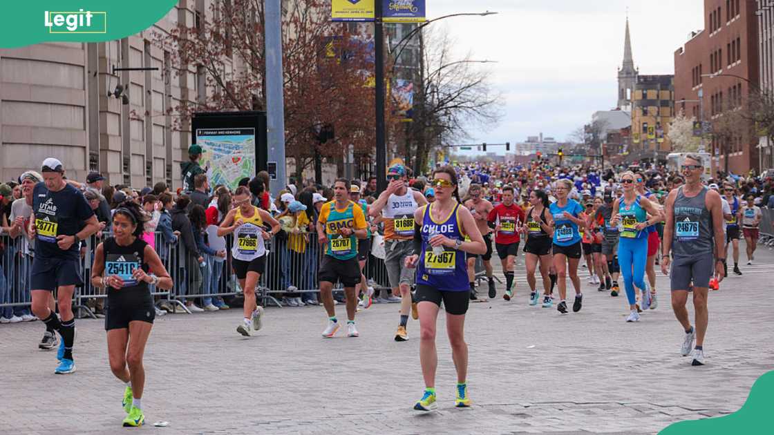 Runners reach the final mile marker