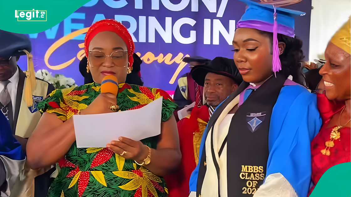 Mother overcome with excitement during medical school induction ceremony award. Mother overcome with excitement during medical school induction ceremony award.