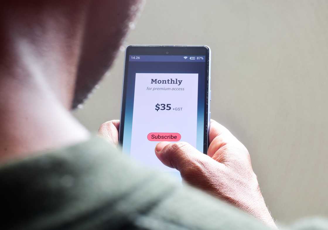 A man managing monthly subscription plan for streaming service. A man managing monthly subscription plan for streaming service.
