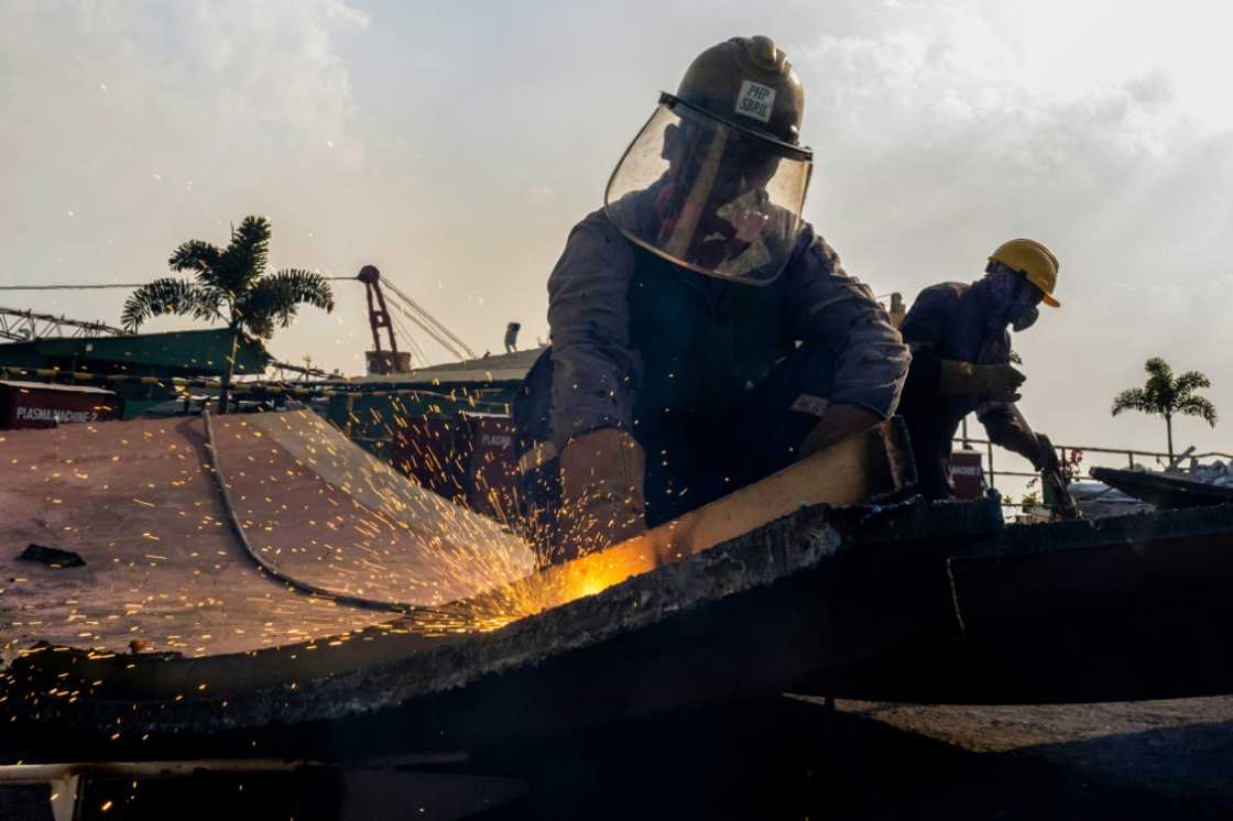 Workers cut down metal parts at the PHP shipbreaking yard in Chittagong, the most advanced in the region Workers cut down metal parts at the PHP shipbreaking yard in Chittagong, the most advanced in the region