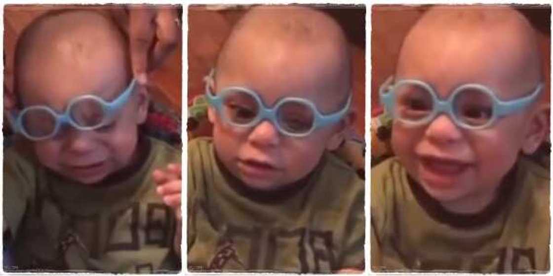 A little boy reacts with a sweet smile after being able to see the world for the very first time A little boy reacts with a sweet smile after being able to see the world for the very first time
