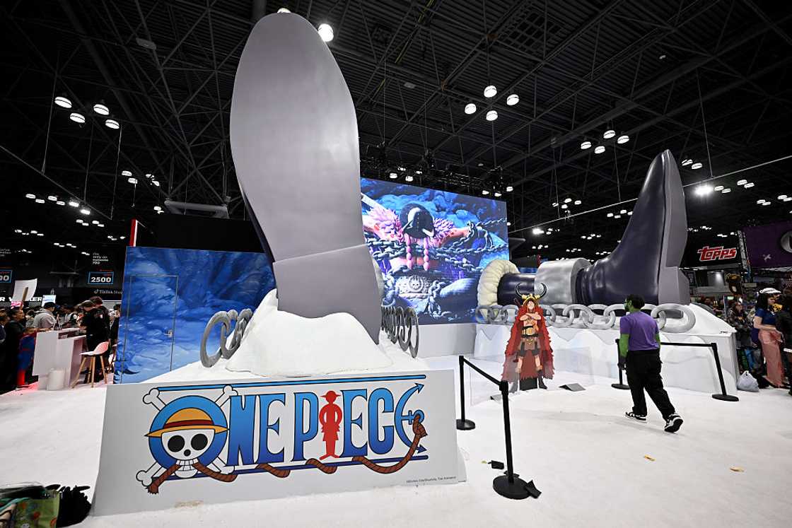 A large One Piece display with a giant sculpture and the show's logo at the Toei Animation booth at New York Comic Con, 2026.
