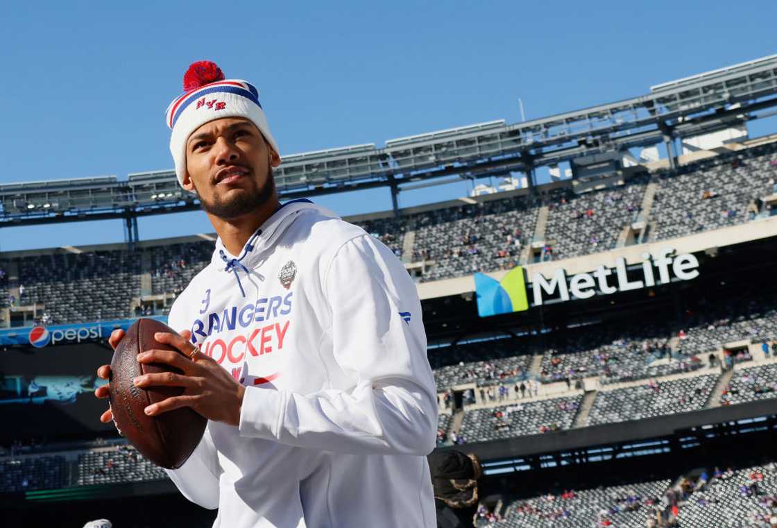 K’Andre Miller warms up prior to playing against the New York Islanders during the 2004 Navy Federal Credit Union Stadium Series game