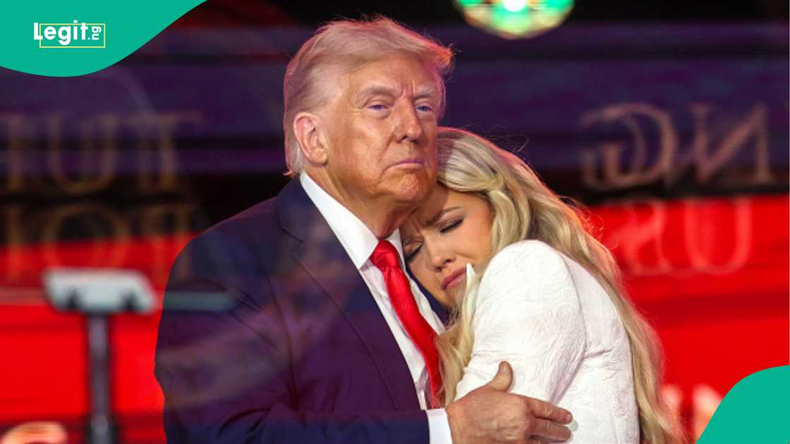 US president Donald Trump condoles with Erika Kirk.