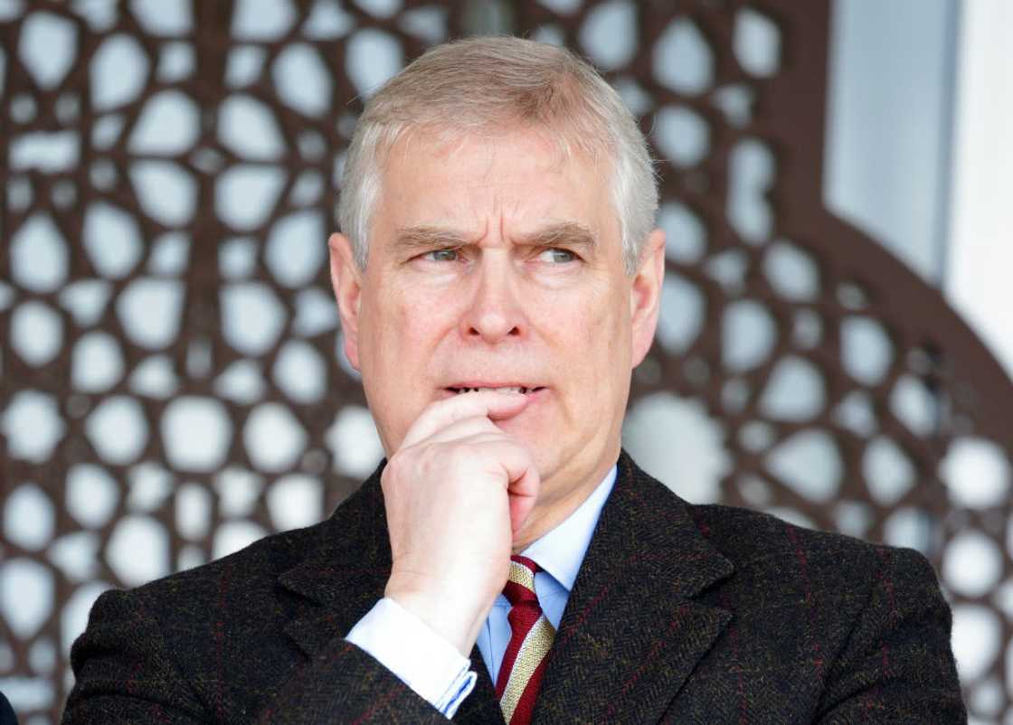 Prince Andrew pictured biting his finger at the Royal Windsor Horse Show