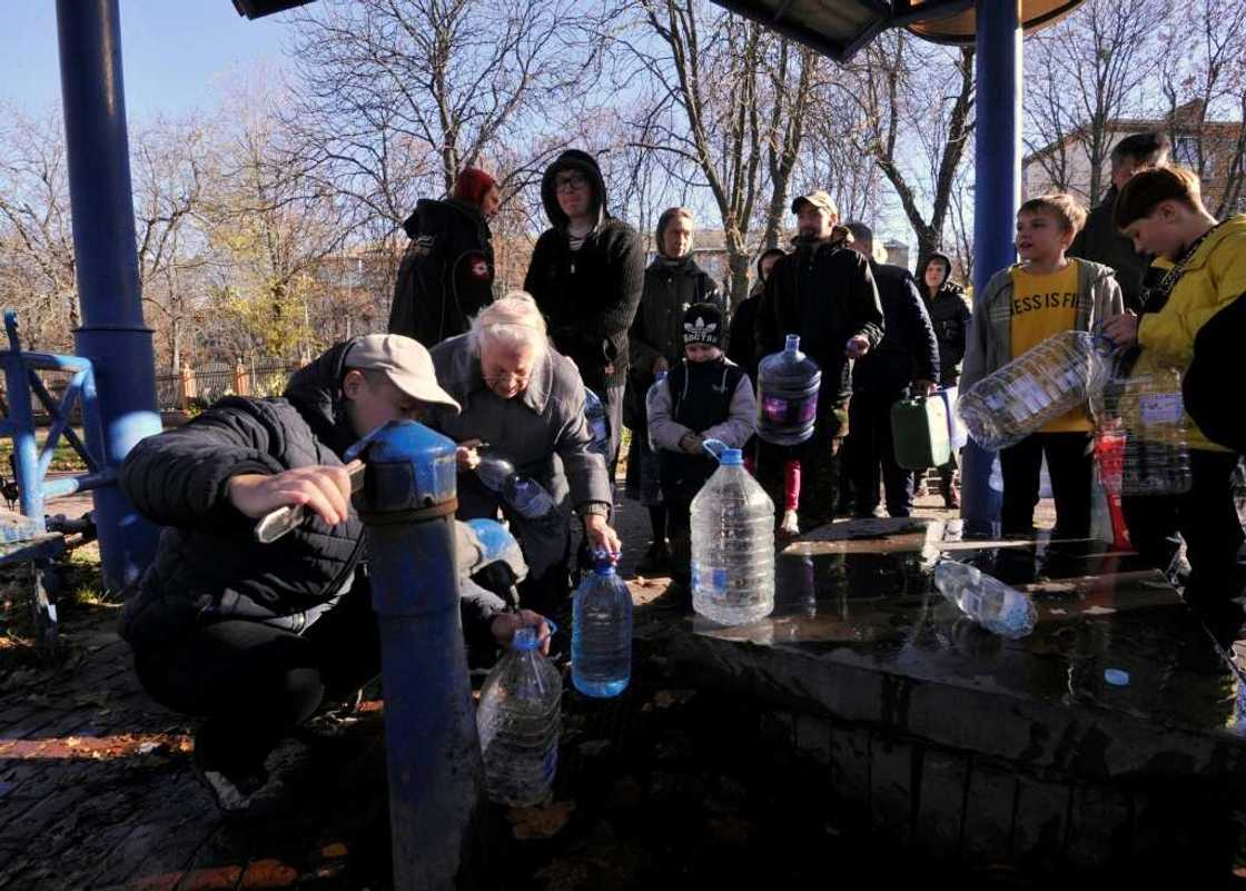 Kyiv residents filled up on water at a park in the Ukrainian capital on Monday Kyiv residents filled up on water at a park in the Ukrainian capital on Monday
