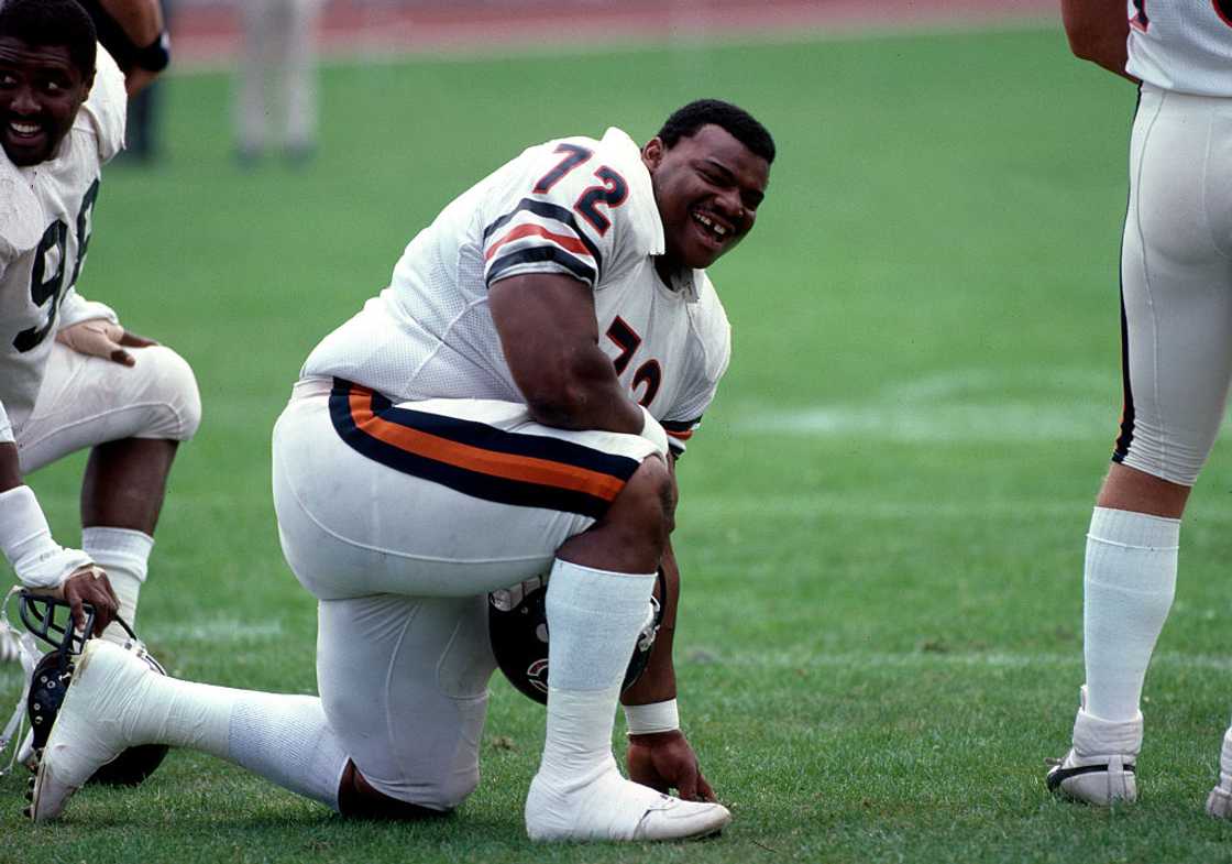 Chicago Bears Training - William 'The Refrigerator' Perry posing for a photo, laughs in training Chicago Bears Training - William 'The Refrigerator' Perry posing for a photo, laughs in training