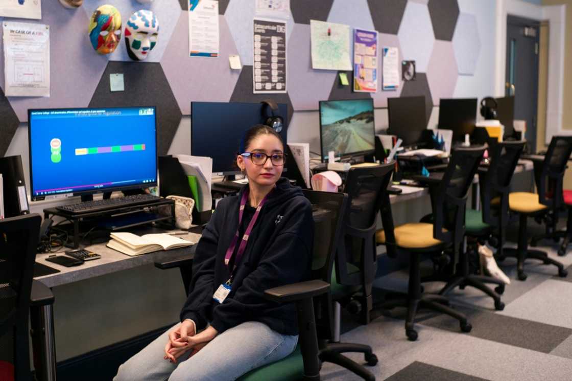 GCSE student Massa Aldalate sits at her desk in the AI classroom at a pioneering college in central London, where there are no teachers and she studies for her exams thanks to an AI course aligned with the national curriciulum with the help of coaches