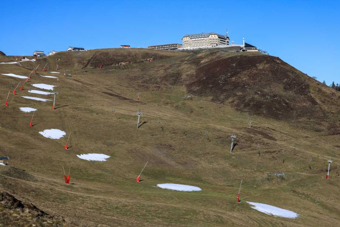 Chairlifts over the green slopes at the Luchon-Superbagneres ski resort, southwestern France, in January 2023