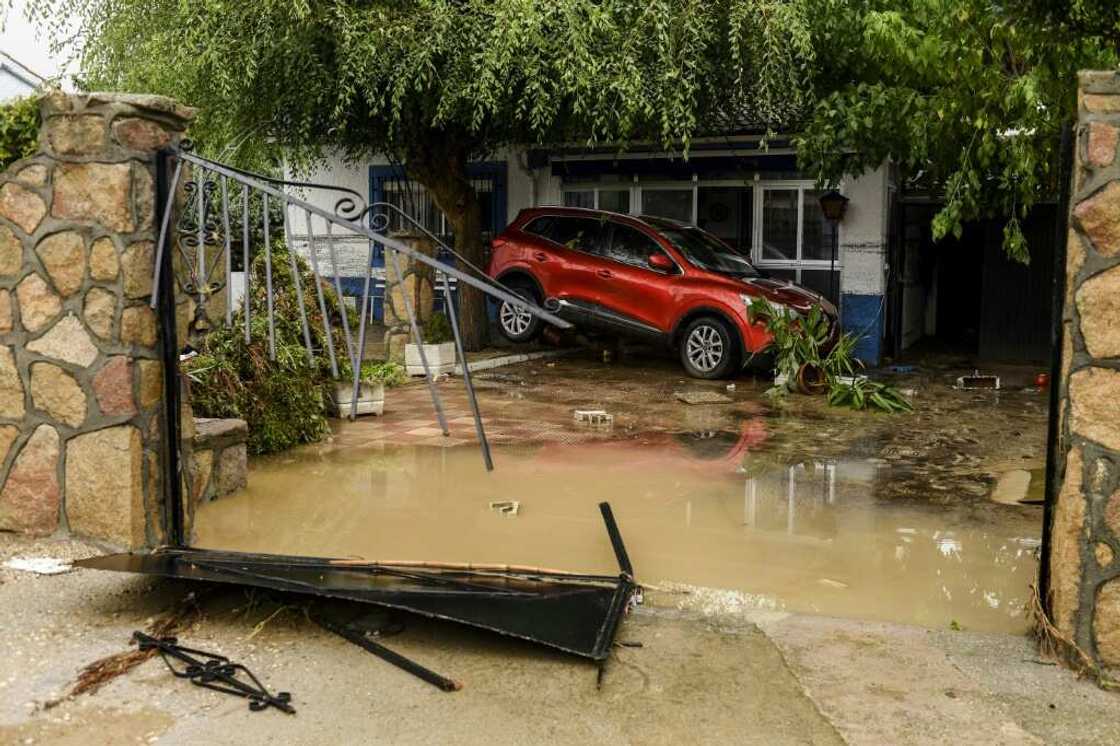 A car stranded in a garden in Aldea del Fresno, near Madrid