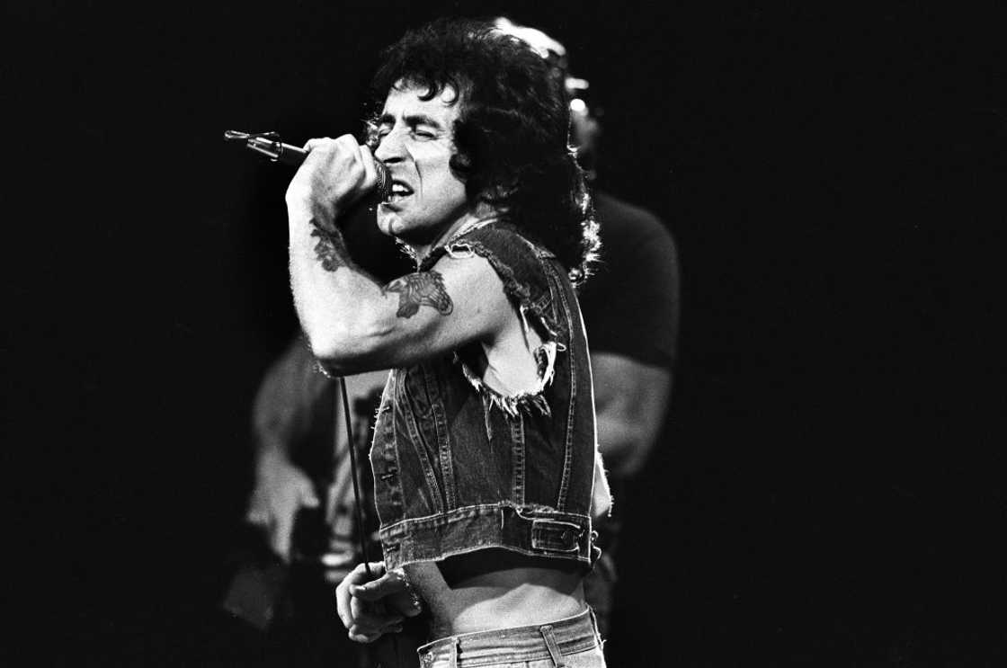 Bon Scott performs on stage