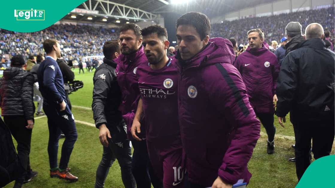 Sergio Aguero, Mikel Arteta, Manchester City, Wigan Athletic, DW Stadium, FA Cup. Sergio Aguero, Mikel Arteta, Manchester City, Wigan Athletic, DW Stadium, FA Cup.
