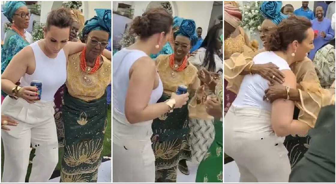 Photos of an Oyinbo lady lady dancing with an old woman. Photos of an Oyinbo lady lady dancing with an old woman.