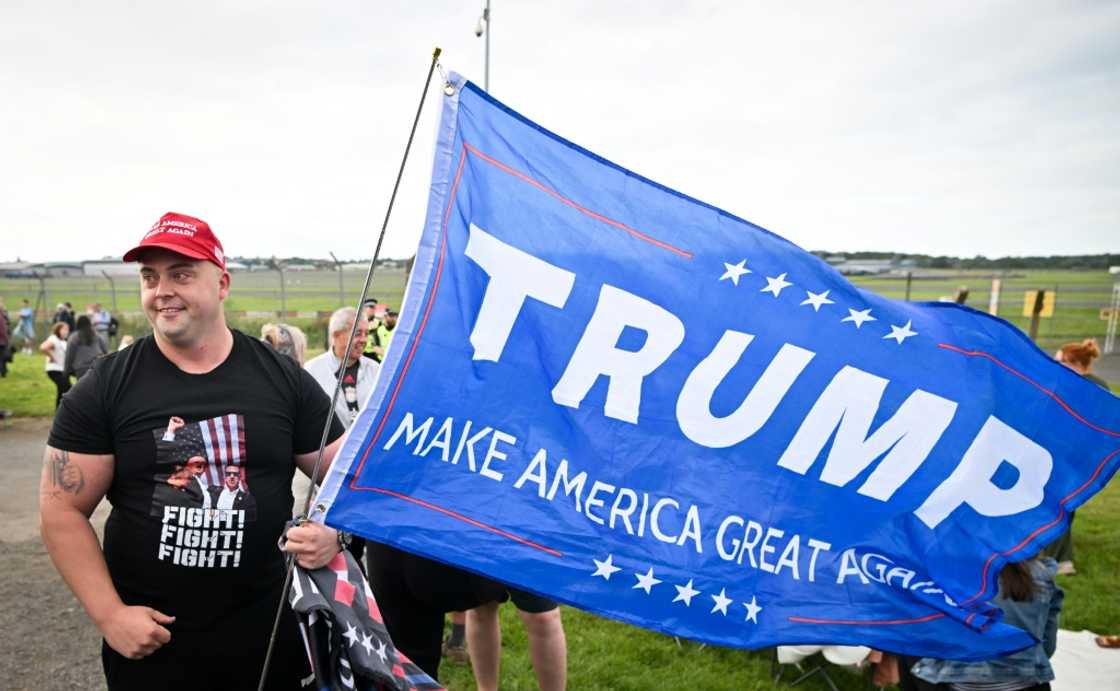 Some Trump supporters turned out to see Trump's plane land at Prestwick