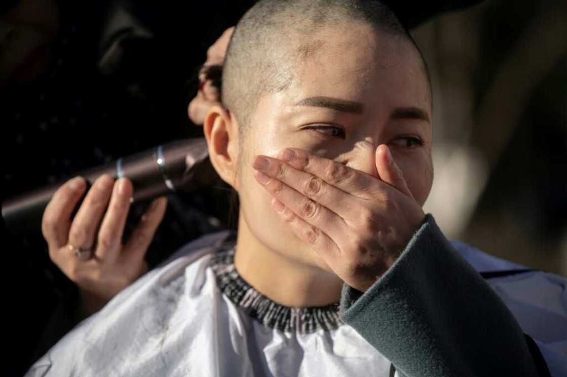 Li Wenzu had her head shaved in 2018 to protest the detention of her husband and human rights lawyer Wang Quanzhang Li Wenzu had her head shaved in 2018 to protest the detention of her husband and human rights lawyer Wang Quanzhang