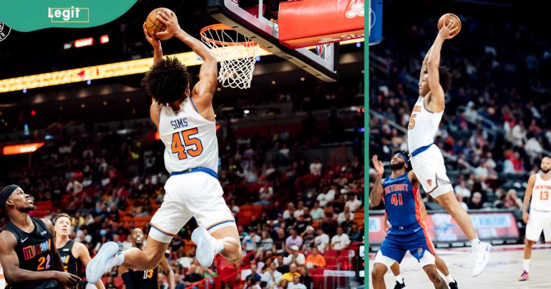 Jericho Sims of the New York Knicks jumps high to dunk.