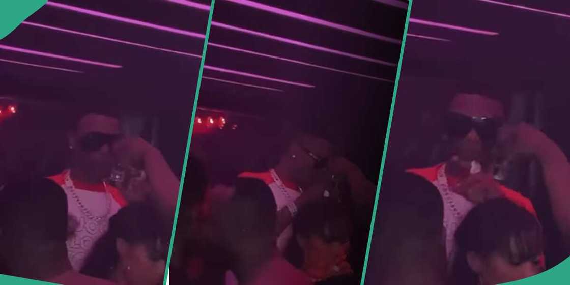 Wizkid refuses drink at nightclub.