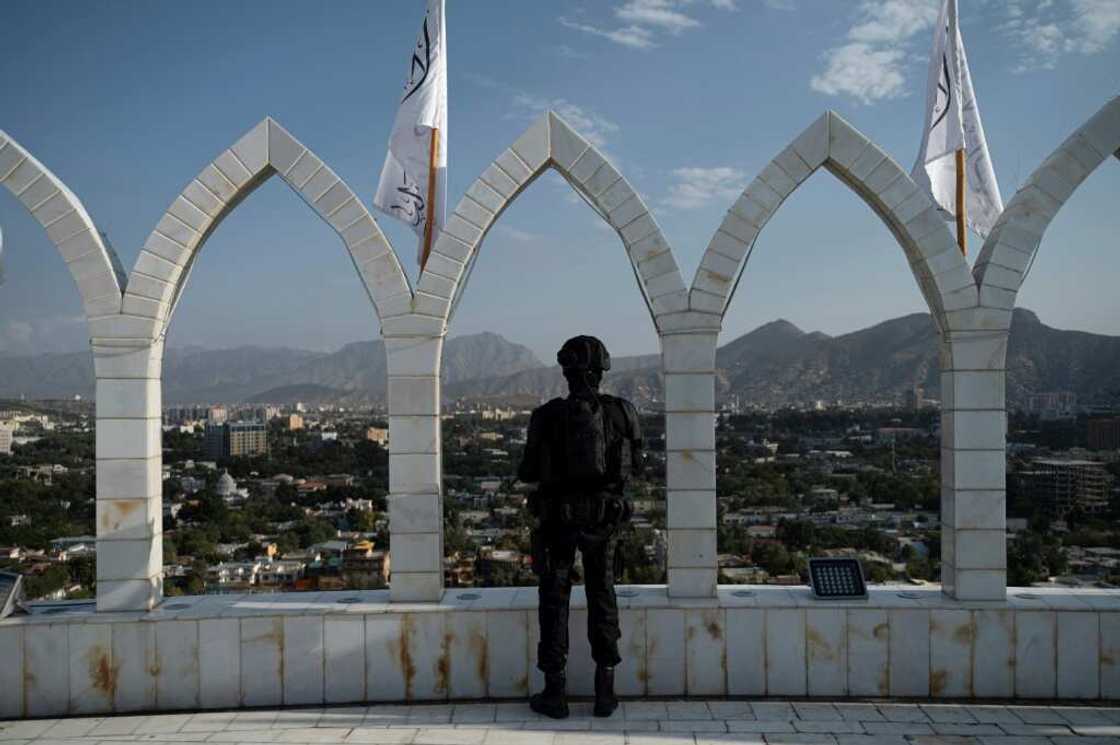 A Taliban fighter stands guard in Kabul on the eve of the first anniversary of the end of the war with US-led foreign forces A Taliban fighter stands guard in Kabul on the eve of the first anniversary of the end of the war with US-led foreign forces