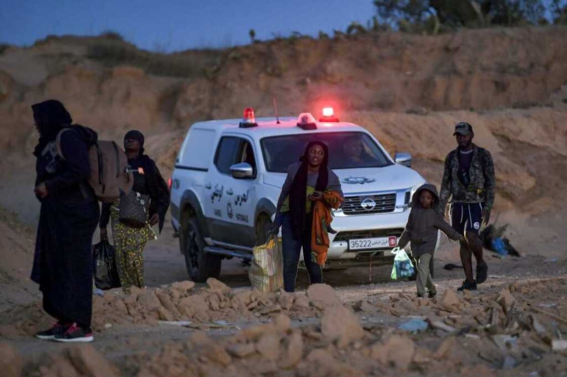 Members of Tunisia's National Guard clear migrants from an olive grove by the sea north of Sfax, suspecting them of preparing to board a vessel leaving clandestinely for Italy Members of Tunisia's National Guard clear migrants from an olive grove by the sea north of Sfax, suspecting them of preparing to board a vessel leaving clandestinely for Italy
