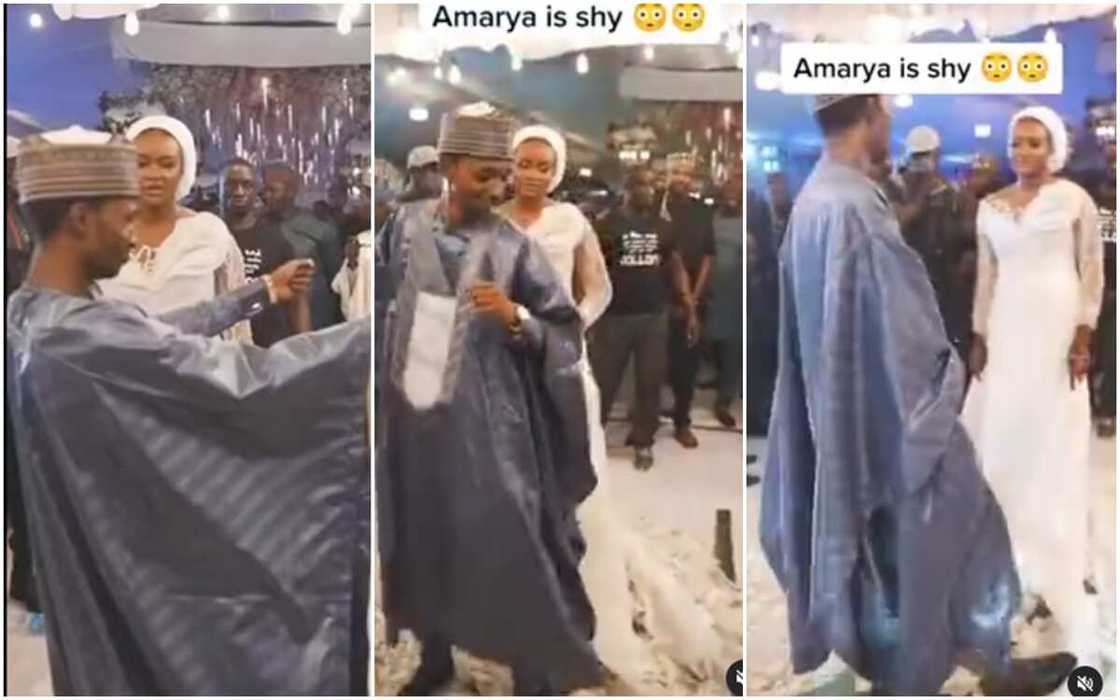 Shy bride stands still and watch while hubby scartter dance. Shy bride stands still and watch while hubby scartter dance.