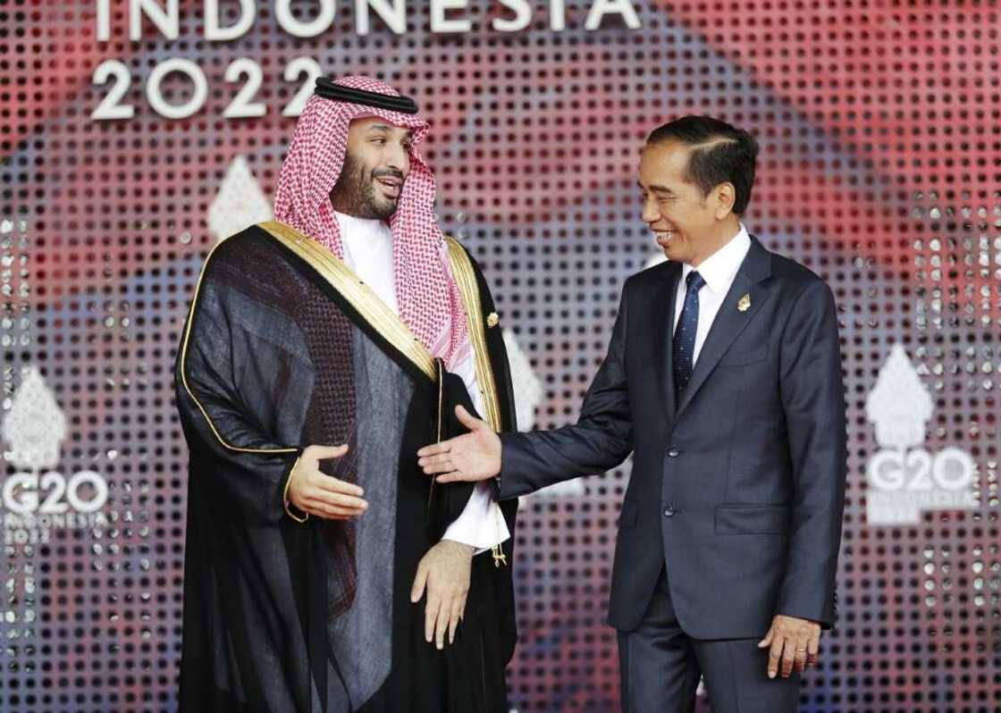 Saudi Arabia's crown prince Mohammed bin Salman (L) meets Indonesia's President Joko Widodo at the G20 leaders' summit in Bali, Indonesia