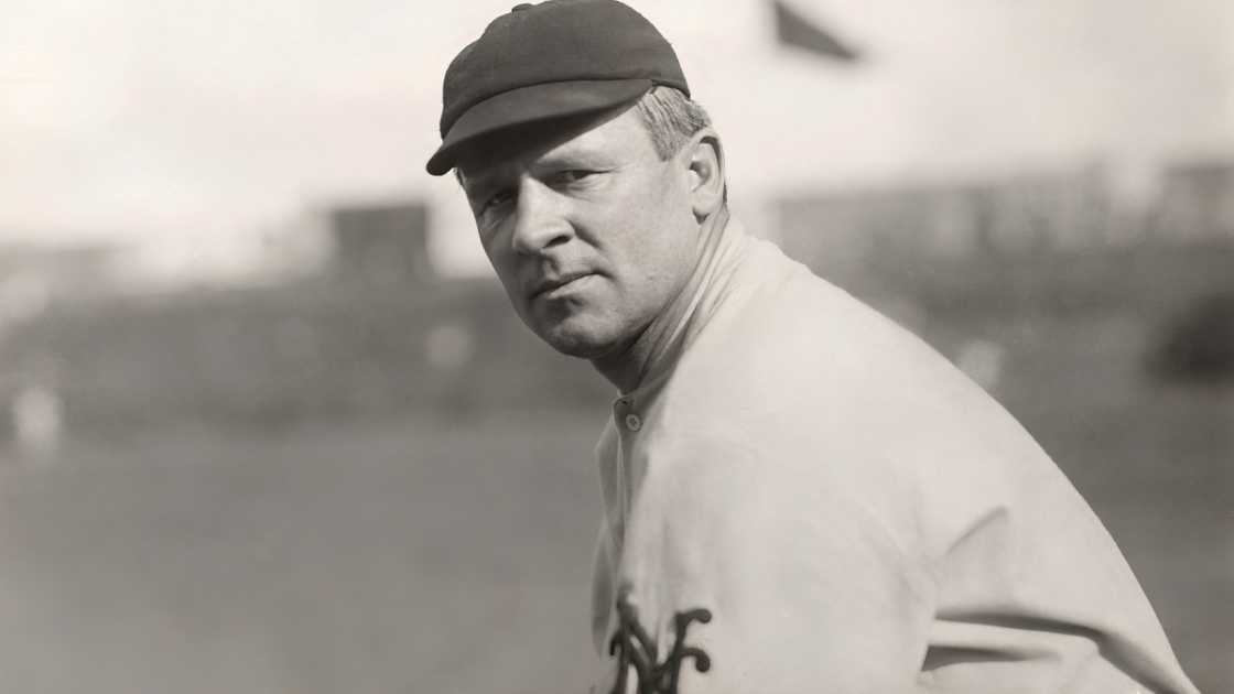 MLB manager, John McGraw, is pictured in batting position.