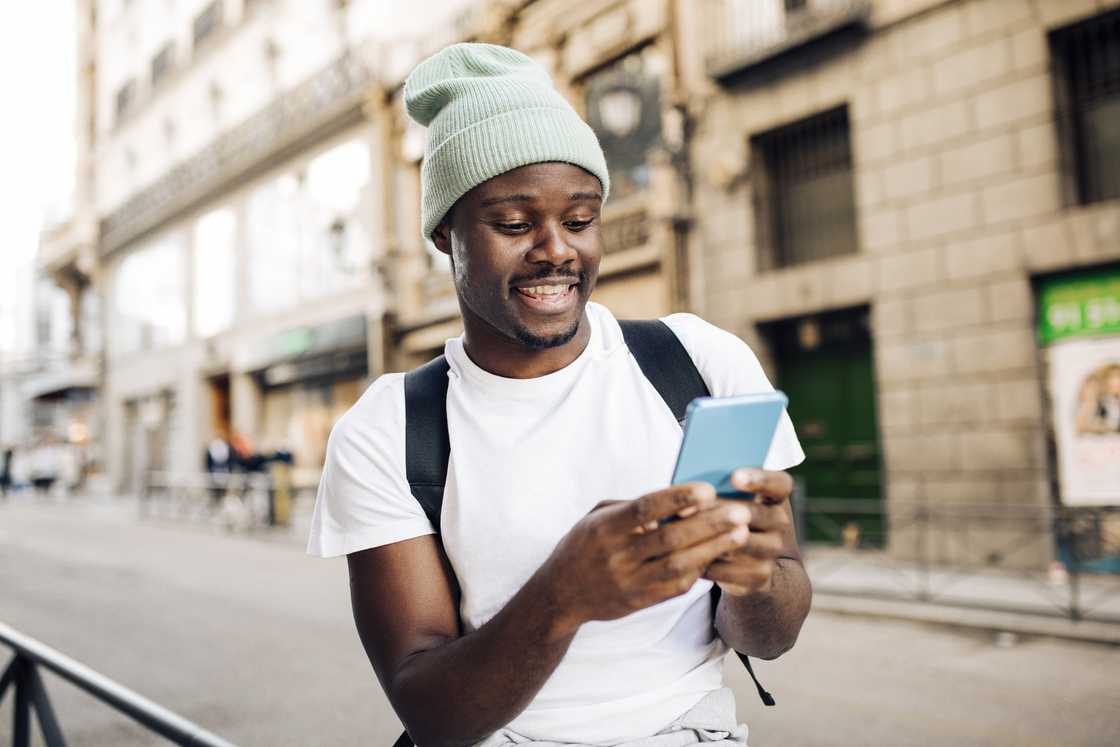 A young man using a smartphone.