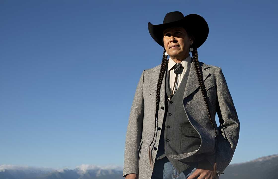 Mo Brings Plenty poses in a production still for Yellowstone.