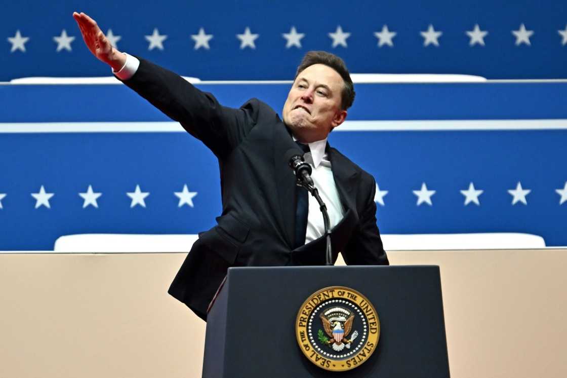 Billionaire Elon Musk gestures during an inaugural event for President Donald Trump inside Washington's Capitol One Arena on Inauguration Day Billionaire Elon Musk gestures during an inaugural event for President Donald Trump inside Washington's Capitol One Arena on Inauguration Day