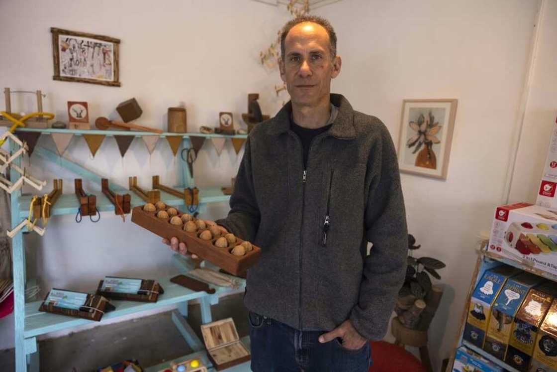 Standing in a former factory in Hanita, a kibbutz in Israel's north, Yuval Vakrat is surrounded by shops, an art gallery and a distillery Standing in a former factory in Hanita, a kibbutz in Israel's north, Yuval Vakrat is surrounded by shops, an art gallery and a distillery