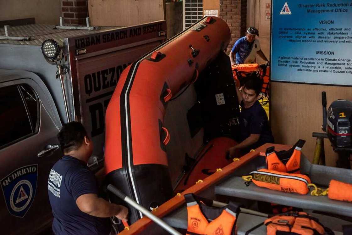 Members of the Disaster Risk Reduction and Management Office prepare rubber boats and life vests ahead of Super Typhoon Noru making landfall Members of the Disaster Risk Reduction and Management Office prepare rubber boats and life vests ahead of Super Typhoon Noru making landfall
