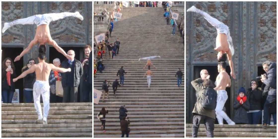 Talented man carries another person upside down firmly on his head as he climbs 90 staircases, video goes viral Talented man carries another person upside down firmly on his head as he climbs 90 staircases, video goes viral