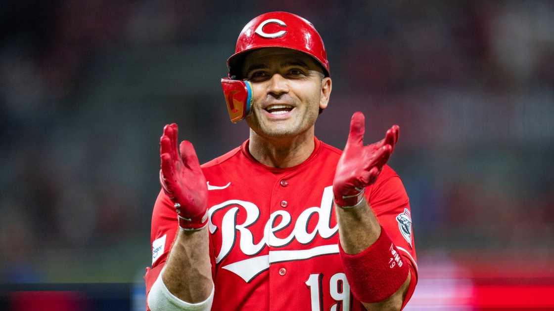 Joey Votto of the Cincinnati Reds claps during a game against the Toronto Blue Jays.