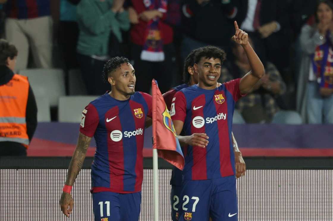 Lamine Yamal (R) and Raphinha (L) scored the goals for Barcelona as they beat Real Sociedad to go second on Monday Lamine Yamal (R) and Raphinha (L) scored the goals for Barcelona as they beat Real Sociedad to go second on Monday