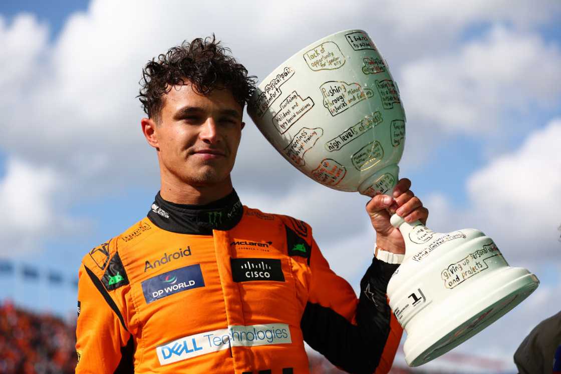 Lando Norris poses for a photo with his trophy in parc ferme after the F1 Grand Prix of Netherlands Lando Norris poses for a photo with his trophy in parc ferme after the F1 Grand Prix of Netherlands