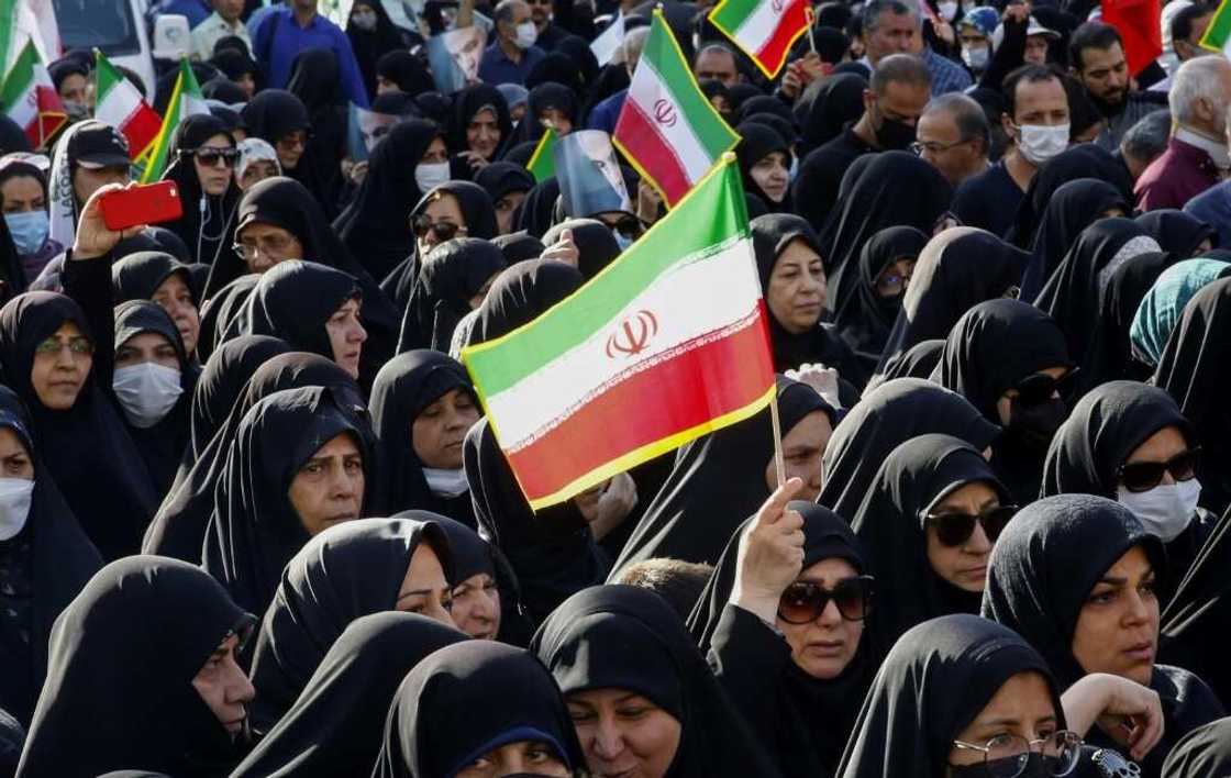 Iranians take part in a pro-government rally Iranians take part in a pro-government rally