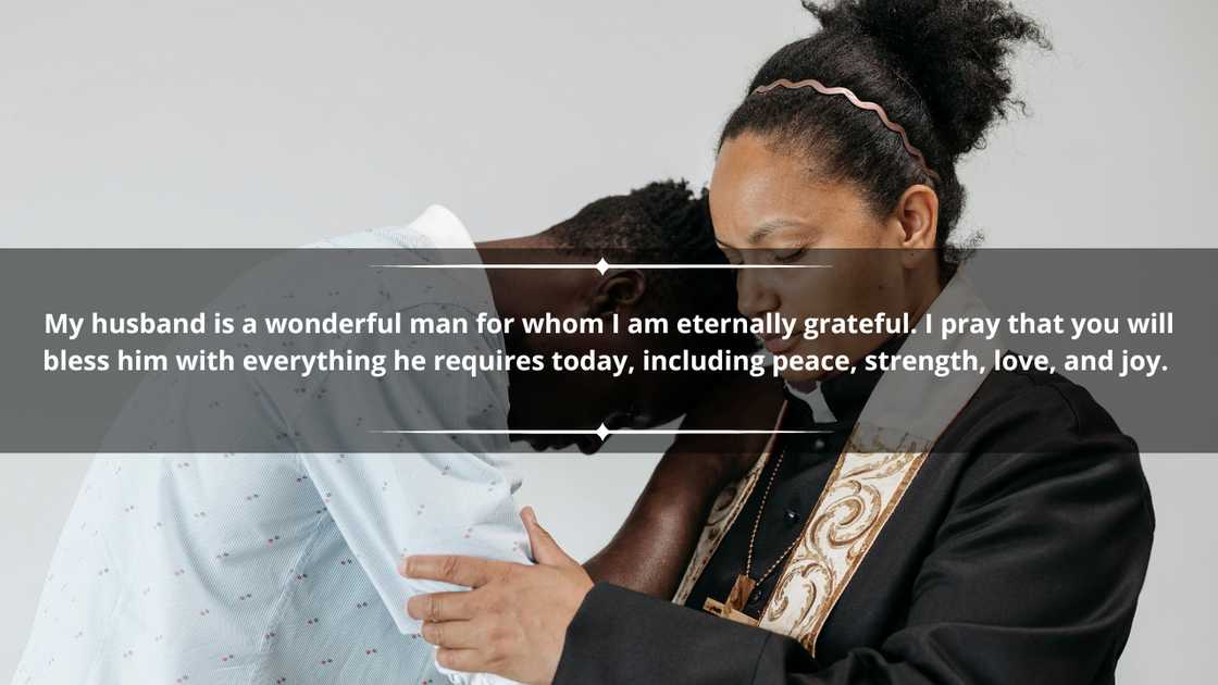 A man in a white shirt is leaning on a female clergy in prayer