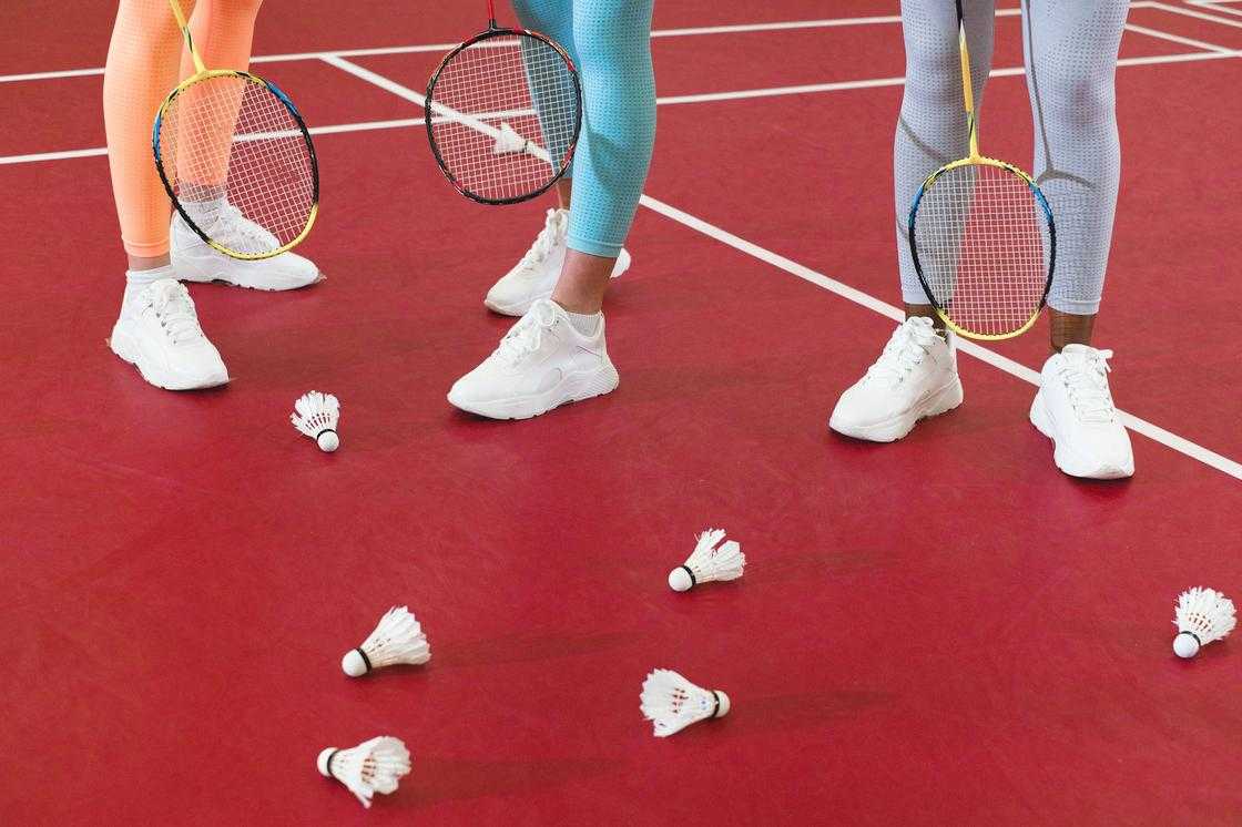 People Holding Badminton Rackets People Holding Badminton Rackets