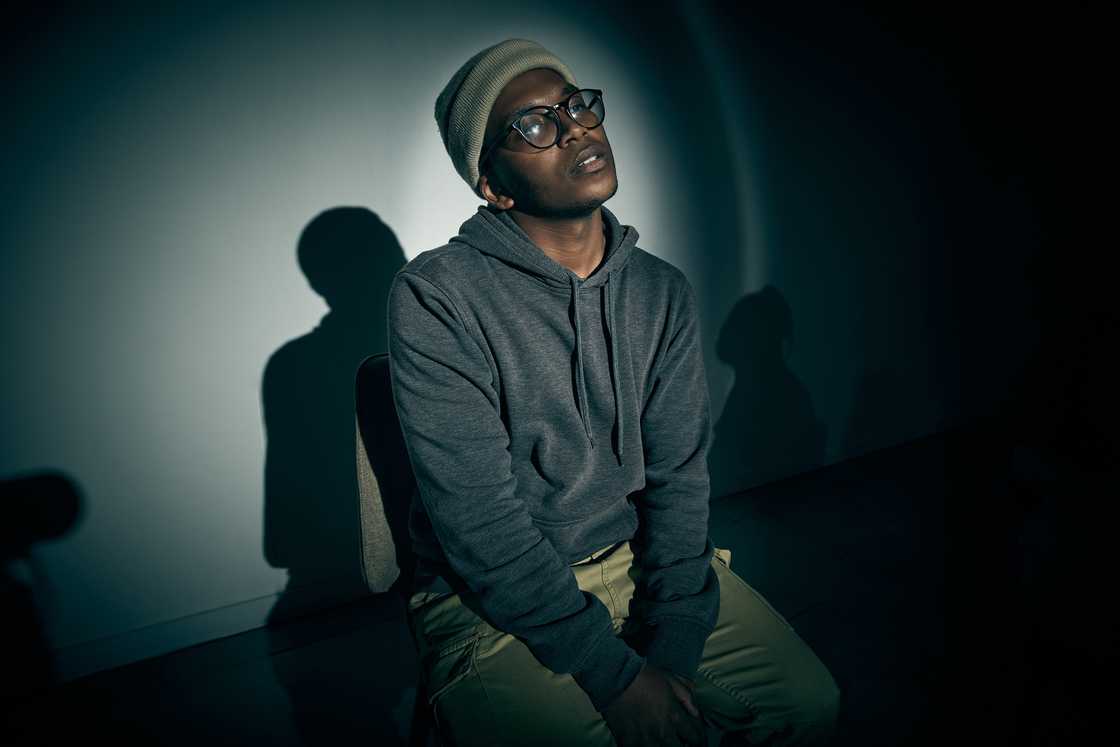 A stressed man in a dark room