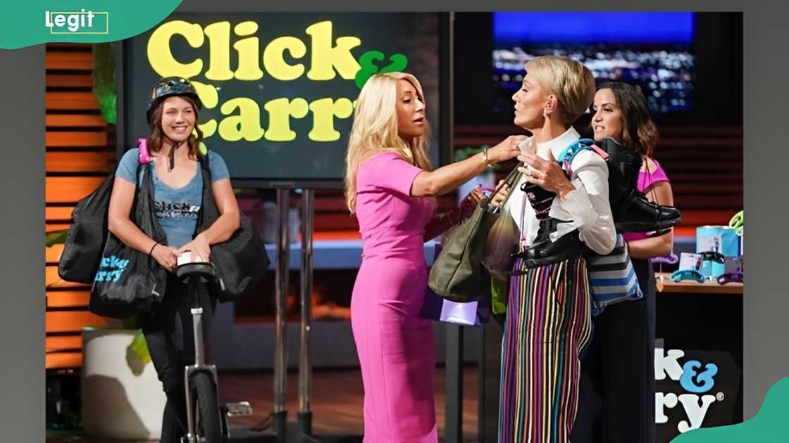 Sharks Lori Greiner and Barbara Corcoran test out the Click and Carry hands-free bag carrier. Sharks Lori Greiner and Barbara Corcoran test out the Click and Carry hands-free bag carrier.
