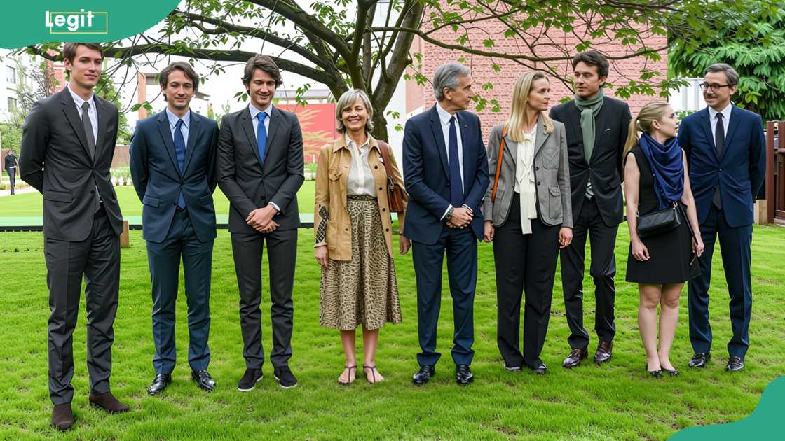 Bernard Arnault (C) poses for pictures with his wife Hélène, and his children Antoine, Delphine, Alexandre, and Frederic