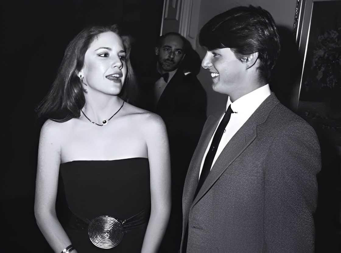 Tom Cruise and Melissa Gilbert in conversation during an event