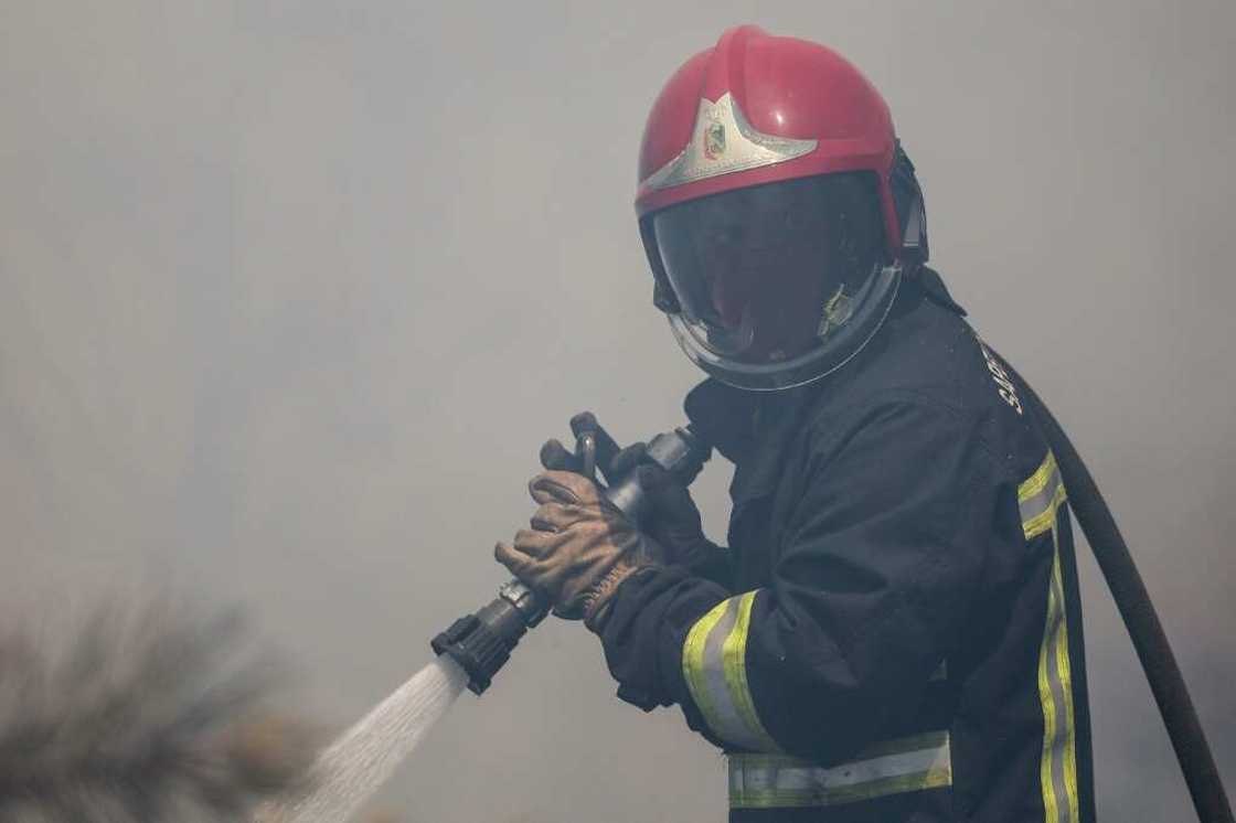 Firefighters will have to continue their work Monday in what one forecaster described as 'an apocalypse of heat' Firefighters will have to continue their work Monday in what one forecaster described as 'an apocalypse of heat'